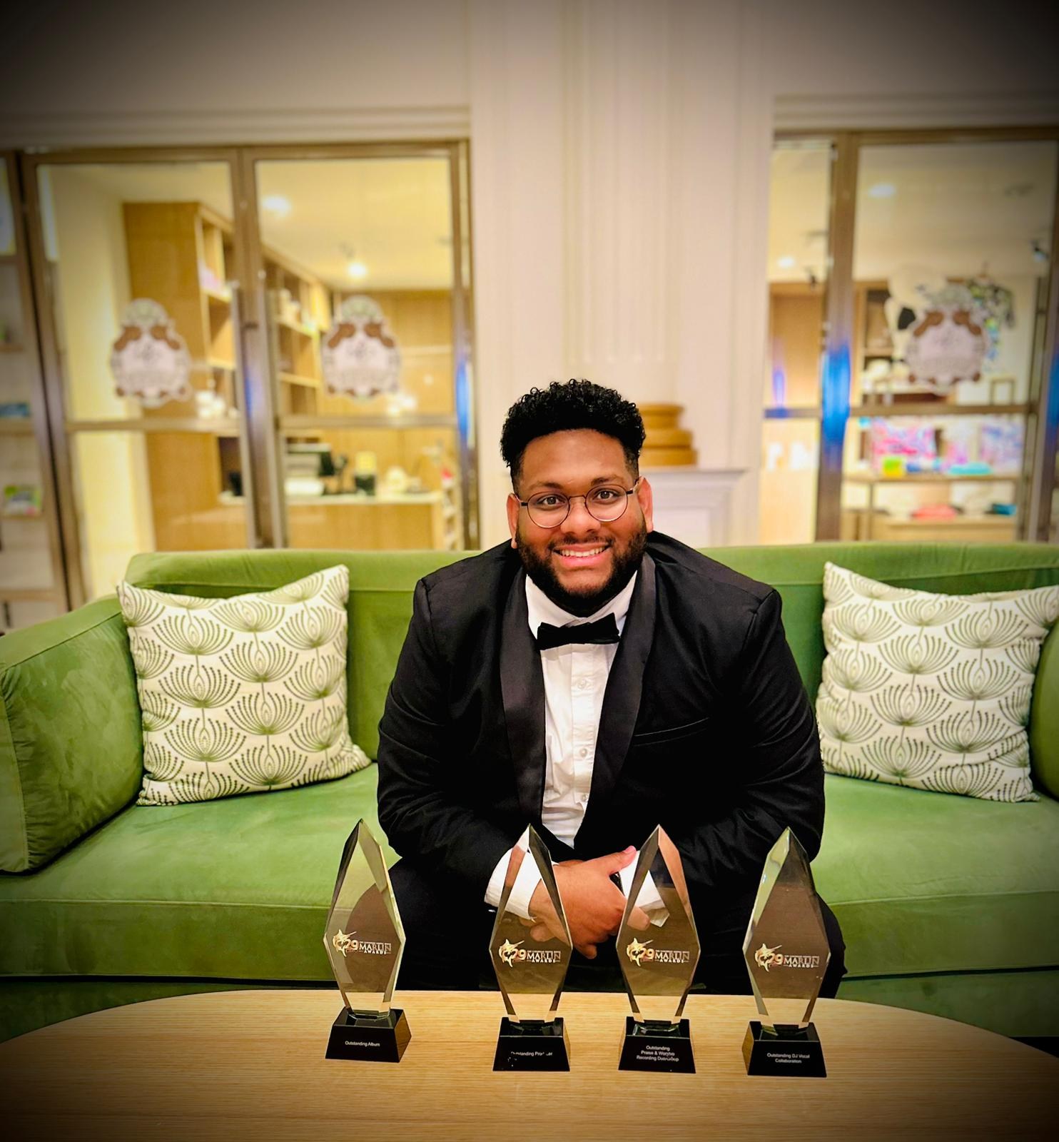 Joshua Ali with His Four Awards Joshua Ali