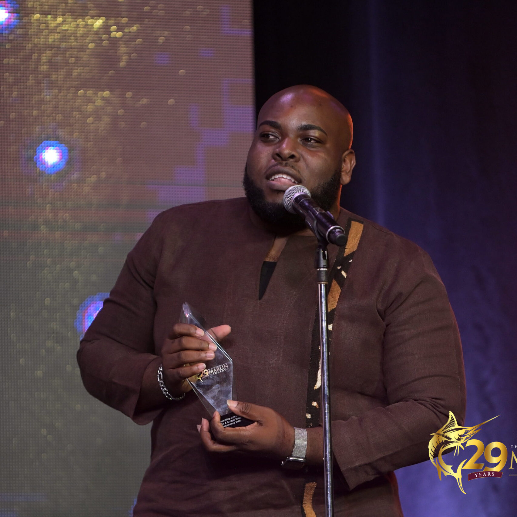 Davian Chase Accepts the Award for Outstanding Junkanoo Rake and Scrape Vocal Performance Solo Davian Chase